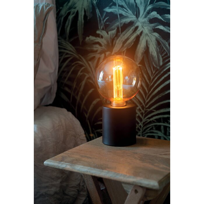 Ampoule LED décorative G125 ambrée à filament en situation d’éclairage ambiance